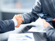 Business people shaking hands in office